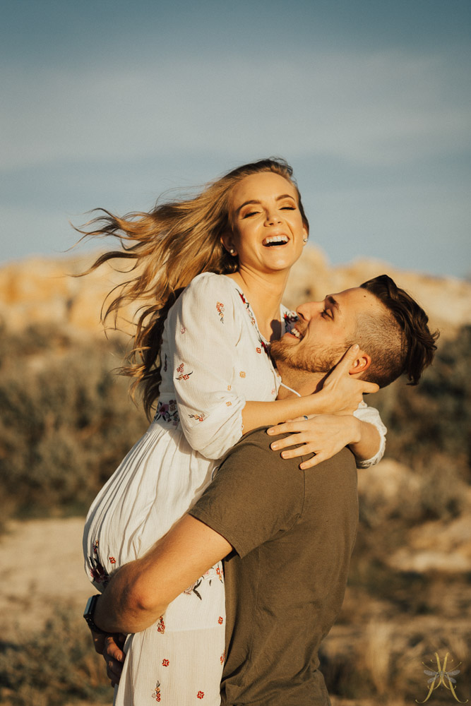 Couple laughing together during their photoshoot