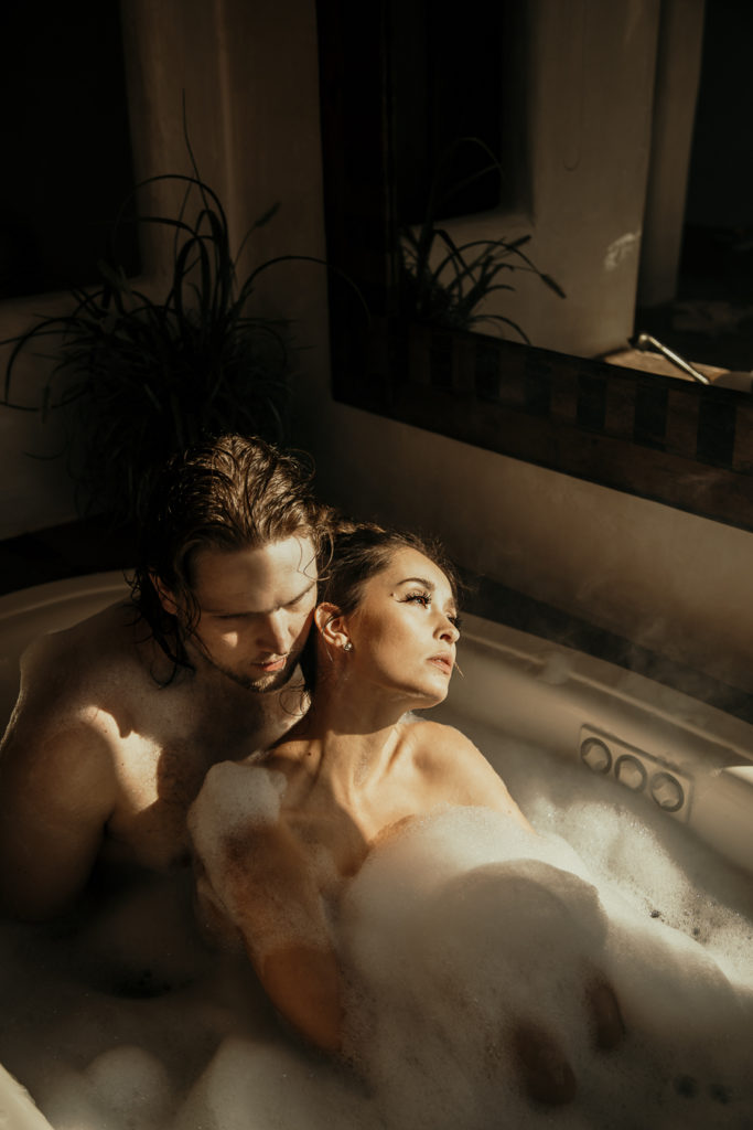 Couple in a bubble bath during their couples photoshoot