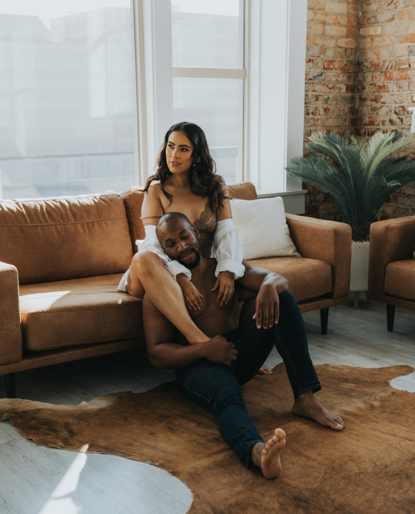 Couple posing on a couch during couples session