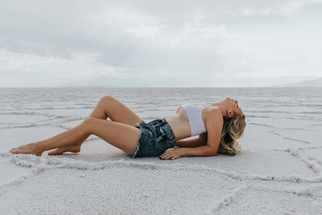 woman wearing a croptop and jean shorts for outdoor boudoir shoot